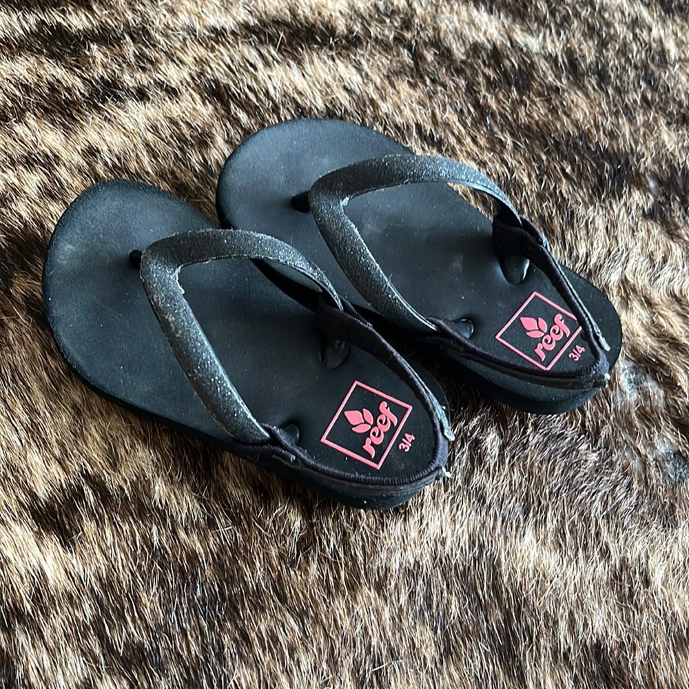 Reef toddler black glitter flip flops.